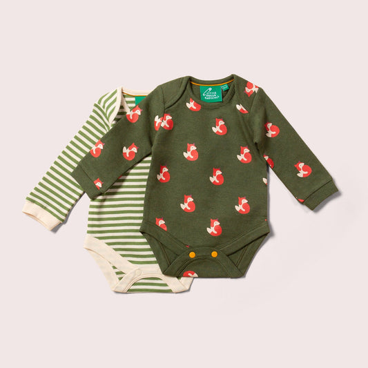 Green baby bodysuit with fox pattern and striped green and white onesie on a light gray background