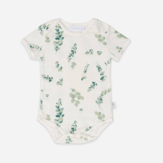 Baby onesie with eucalyptus leaf pattern on a white background