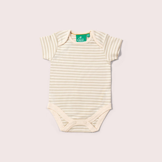 Yellow baby bodysuit with sheep pattern on a light gray background