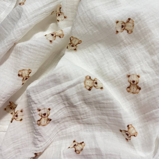 White fabric with small brown bear patterns