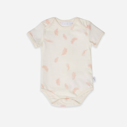 Baby onesie with pink abstract pattern on a white background