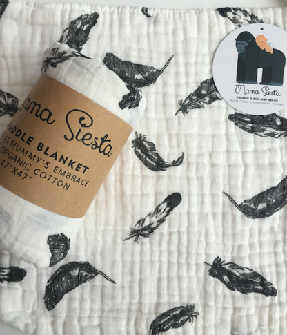 Baby blanket with feather pattern and 'Mama Siesta' label