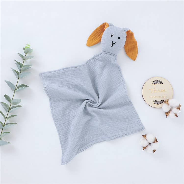 Gray baby comfort blanket with a dog face design on a white background