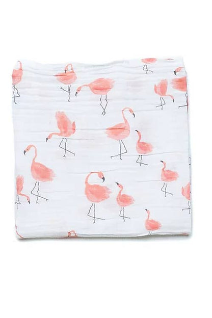 Folded fabric with pink flamingo pattern on a white background