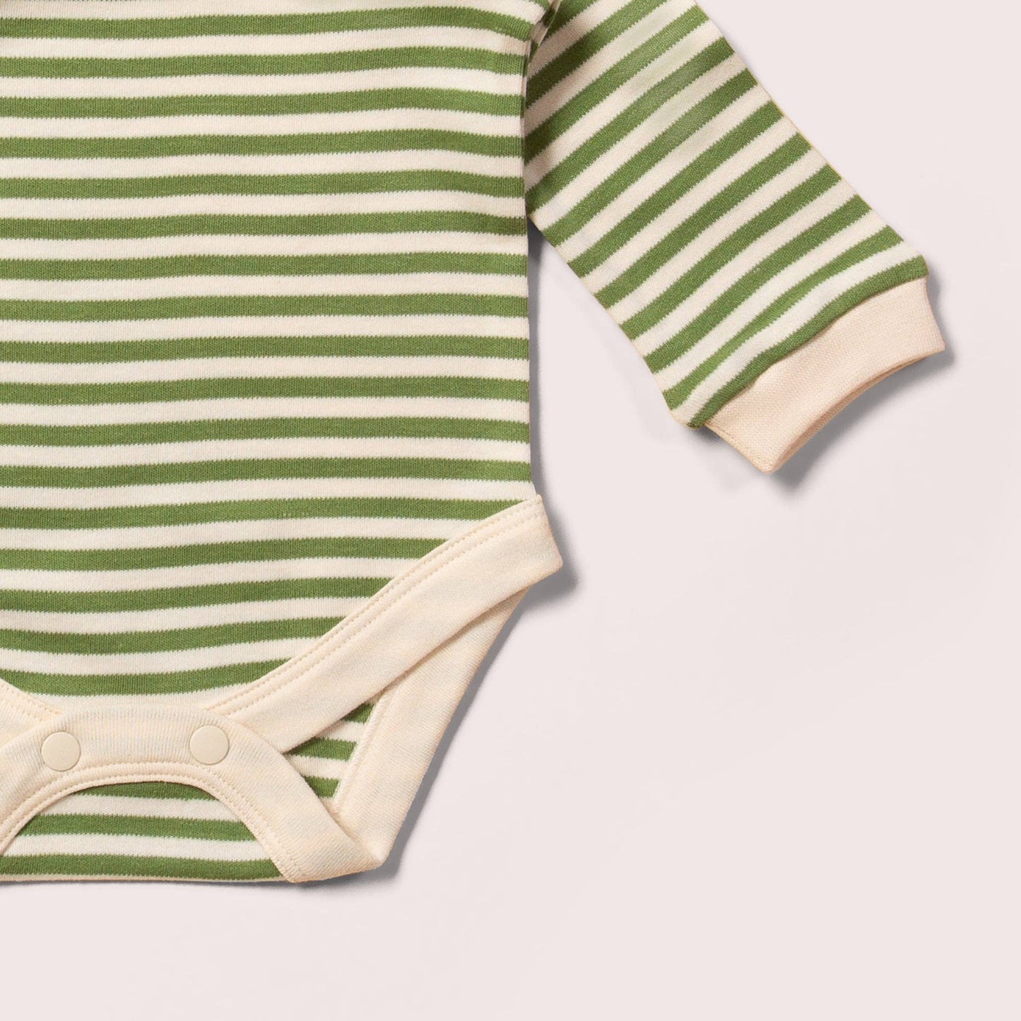 Green and white striped baby bodysuit on a light gray background
