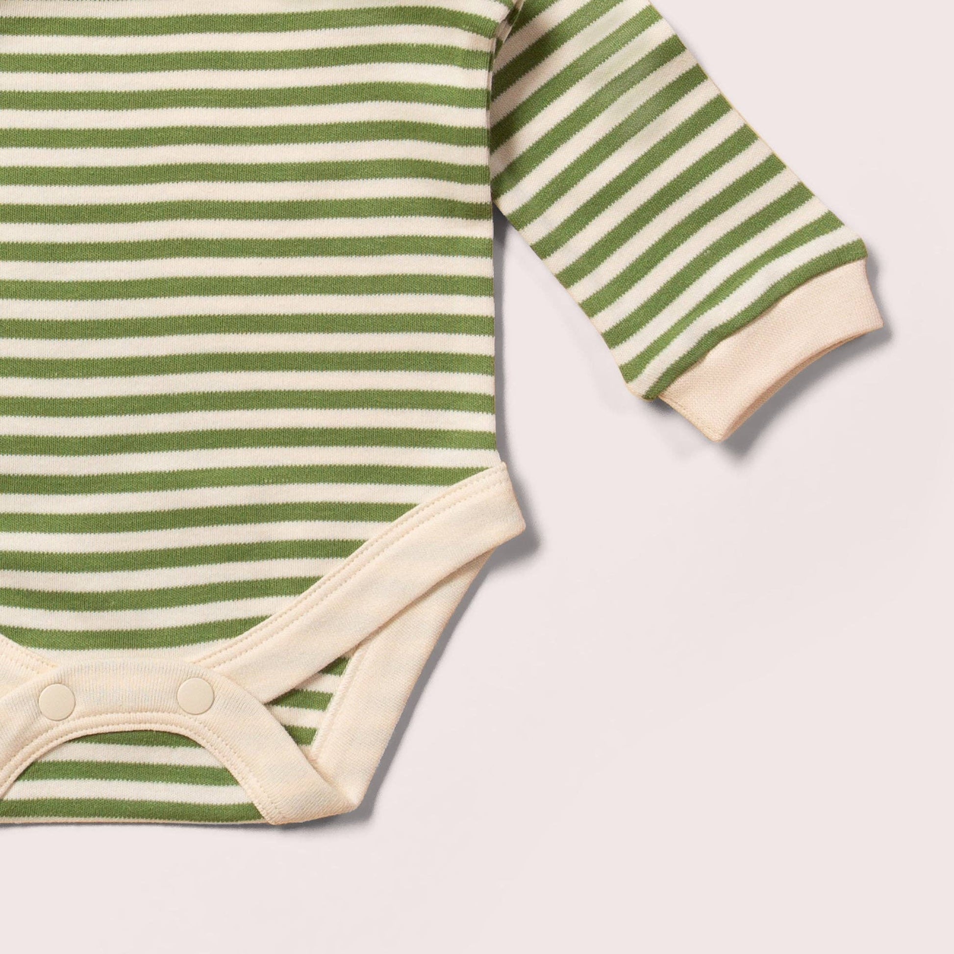 Green and white striped baby bodysuit on a light gray background