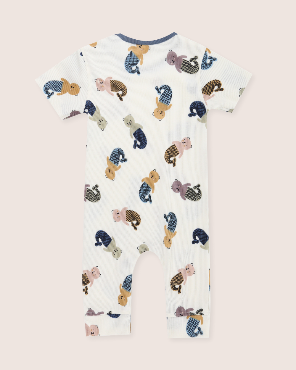 Children's onesie with animal pattern on a light pink background