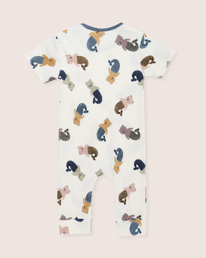 Children's onesie with animal pattern on a light pink background