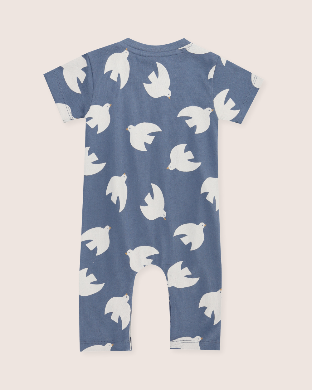 Blue romper with white bird pattern on a light gray background