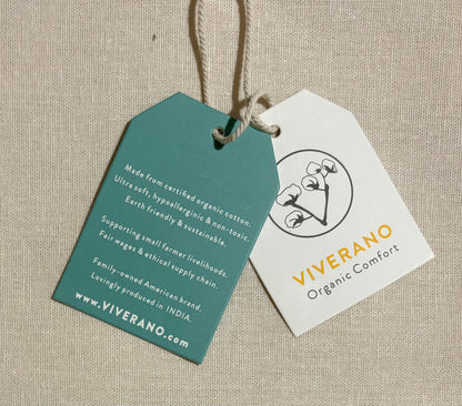 Two product tags on a beige fabric background, one green and one white, with 'Viverano' branding.